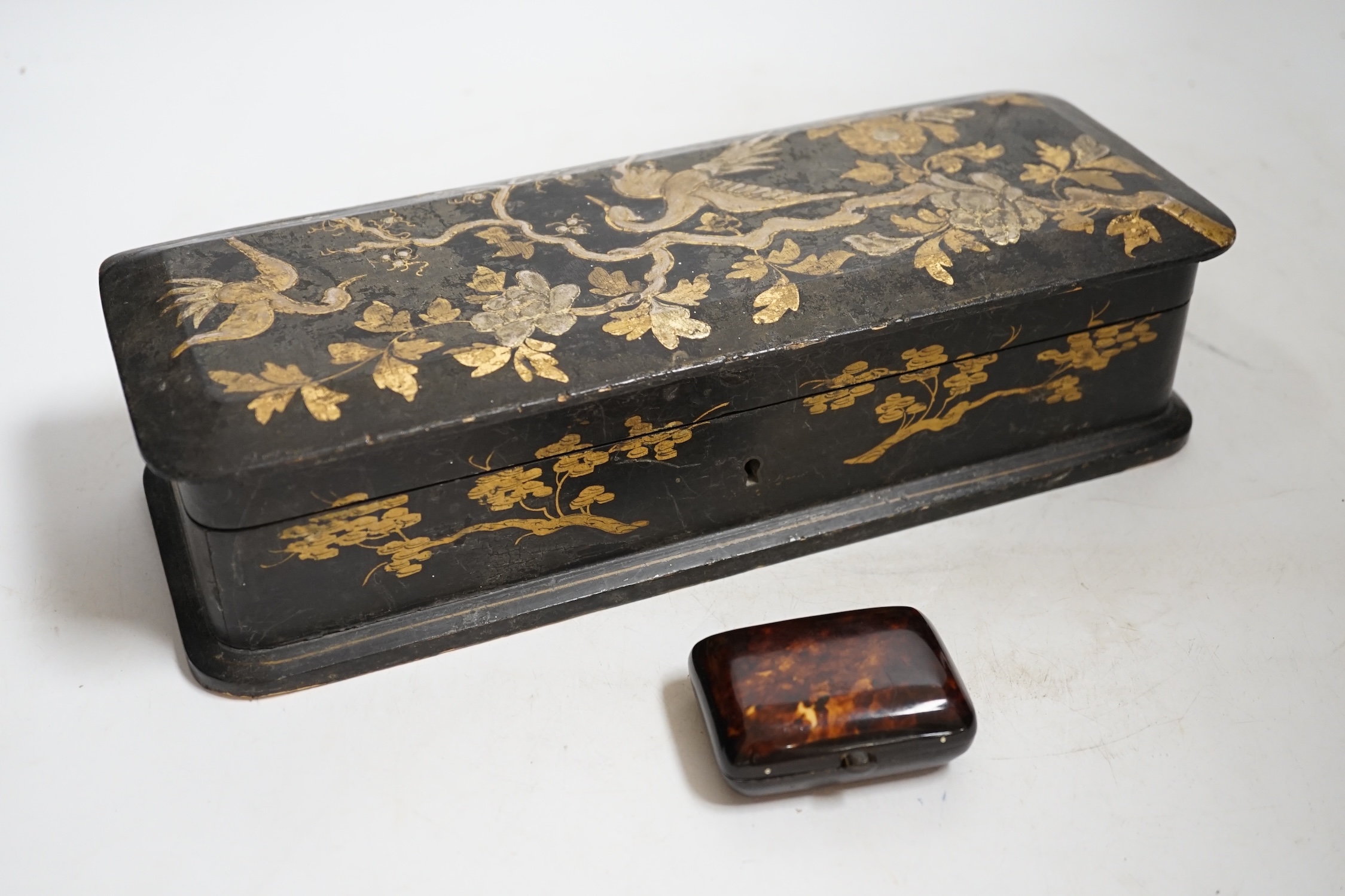 A French japanned papier maché glove box together with a tortoiseshell card case inlaid with white and yellow metal, largest 30cm wide. Condition- fair